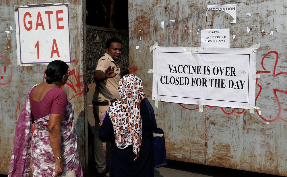 Indian vaccine over sign - enlarge